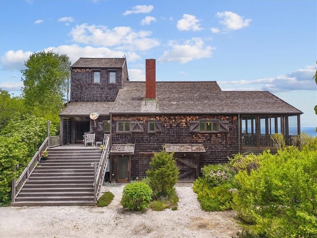 1635 Isabella Beach Rd, Southold, NY 06390 - view of front of home with stairs and a chimney