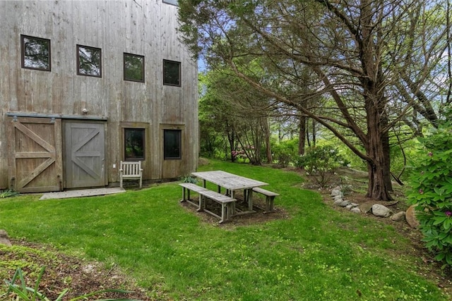 1635 Isabella Beach Rd, Southold, NY 06390 - view of green lawn with a barn and an outbuilding