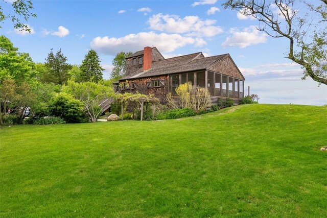 1635 Isabella Beach Rd, Southold, NY 06390 - view of green lawn featuring a sunroom