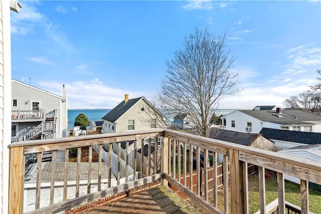 wooden deck featuring a water view