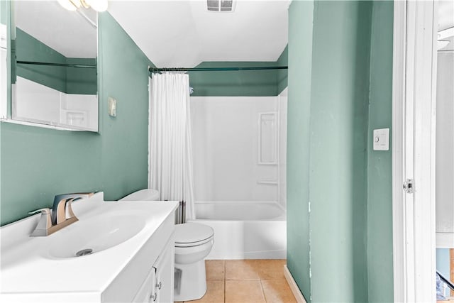 full bathroom with tile patterned floors, vanity, shower / tub combo, and toilet