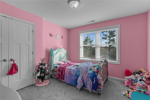 bedroom featuring light carpet