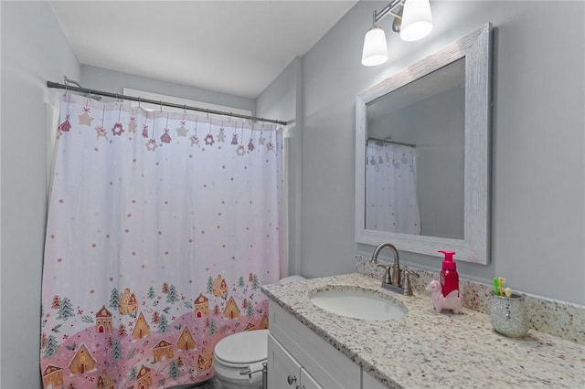 bathroom with walk in shower, vanity, and toilet