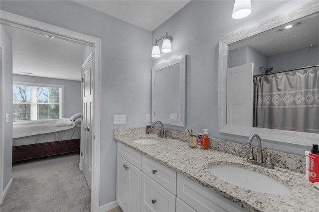 bathroom with a shower with curtain and vanity