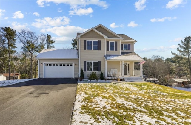 view of front of house featuring a porch and a garage