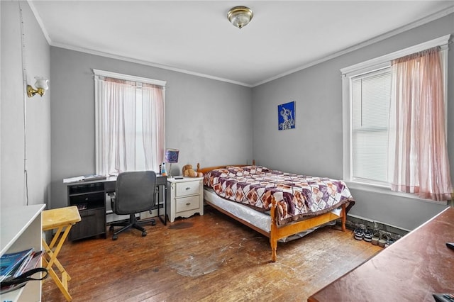 bedroom featuring dark hardwood / wood-style floors and ornamental molding