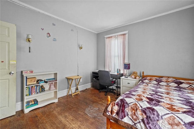 bedroom with dark hardwood / wood-style flooring and ornamental molding