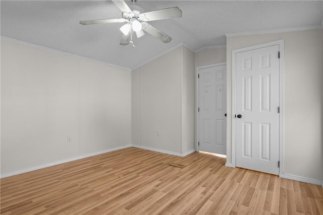 bonus room featuring a textured ceiling, light hardwood / wood-style flooring, vaulted ceiling, and ceiling fan