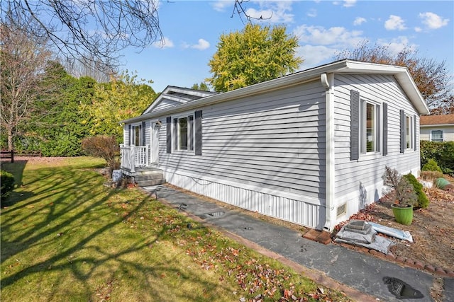 view of property exterior featuring a yard