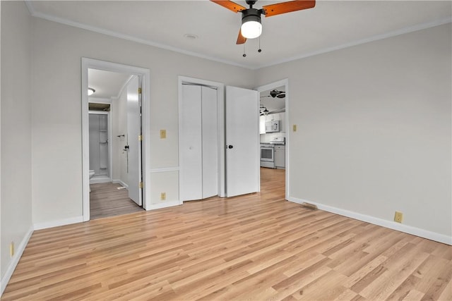 unfurnished bedroom with ceiling fan, ensuite bathroom, and ornamental molding