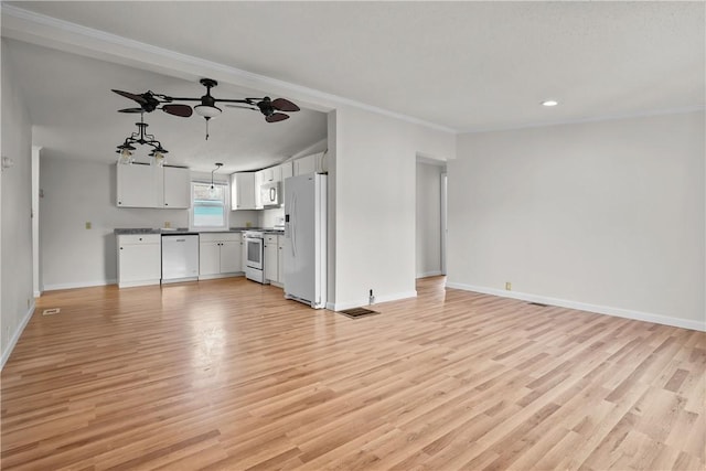 unfurnished living room featuring light hardwood / wood-style floors and ornamental molding