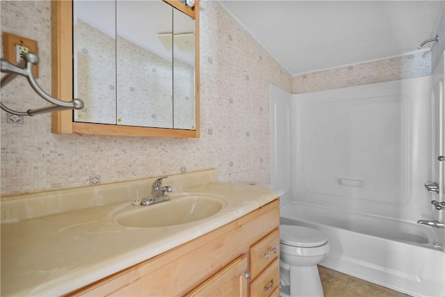 full bathroom featuring vanity, toilet, shower / bathtub combination, and vaulted ceiling