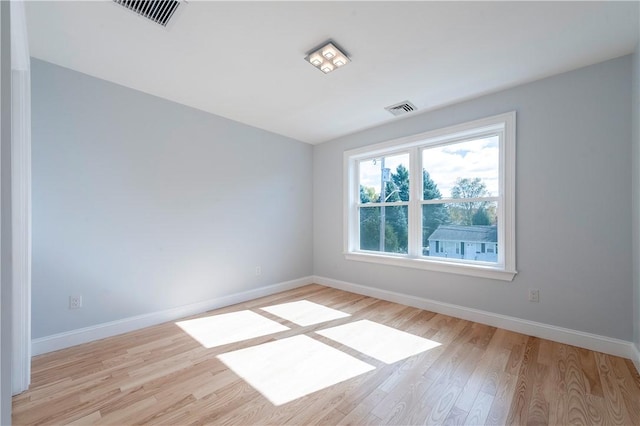 unfurnished room featuring light hardwood / wood-style floors