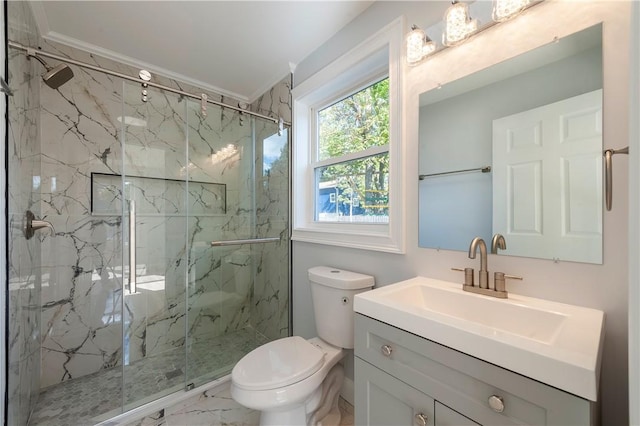 bathroom featuring an enclosed shower, vanity, toilet, and crown molding