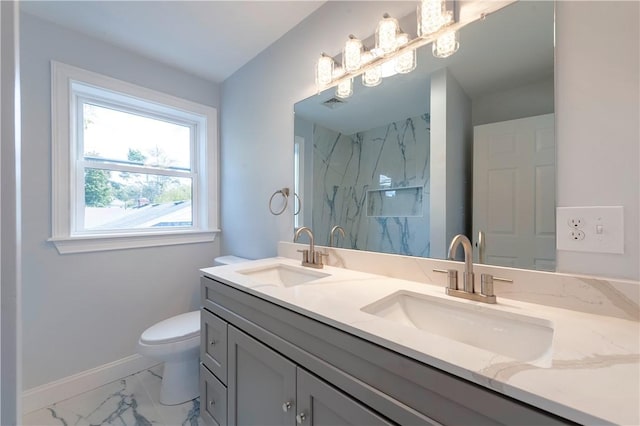 bathroom featuring toilet and vanity