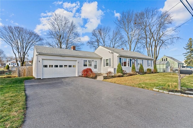 single story home featuring a front yard and a garage