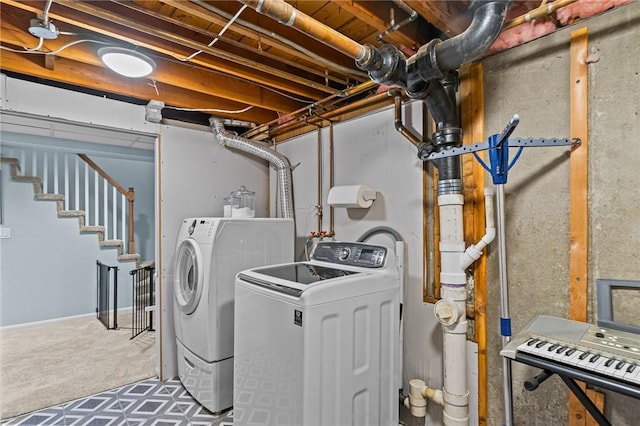 laundry area with washing machine and clothes dryer