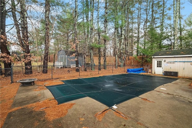 view of swimming pool with an outdoor structure