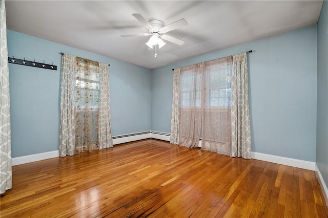 unfurnished room featuring ceiling fan and hardwood / wood-style floors