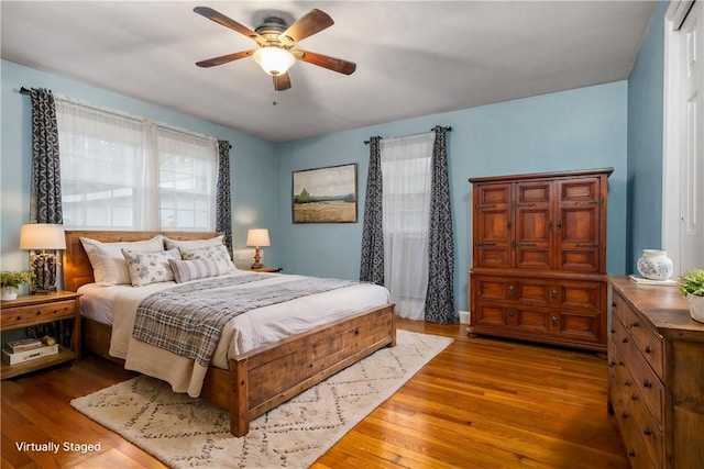 bedroom featuring ceiling fan and hardwood / wood-style floors