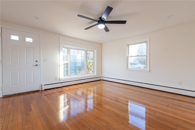 entryway featuring hardwood / wood-style flooring, a baseboard radiator, and ceiling fan