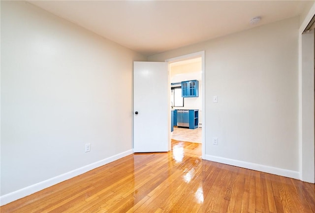 spare room featuring light wood-type flooring