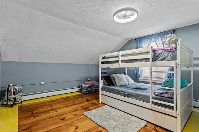 bedroom with a textured ceiling, a baseboard radiator, lofted ceiling, and wood-type flooring