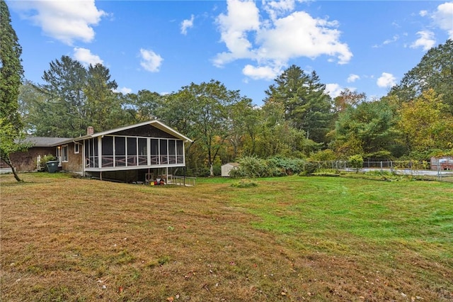 view of yard featuring a sunroom