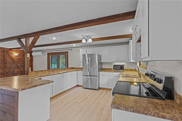 kitchen with kitchen peninsula, stainless steel appliances, a wall mounted AC, sink, and white cabinets