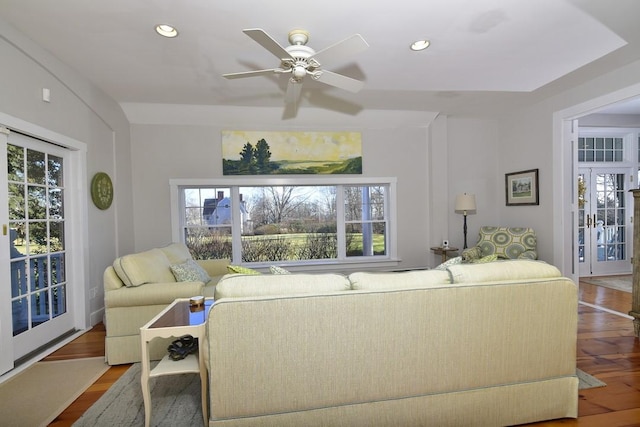 living room featuring hardwood / wood-style flooring, plenty of natural light, and ceiling fan