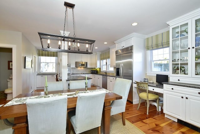 dining space featuring dark hardwood / wood-style flooring and sink