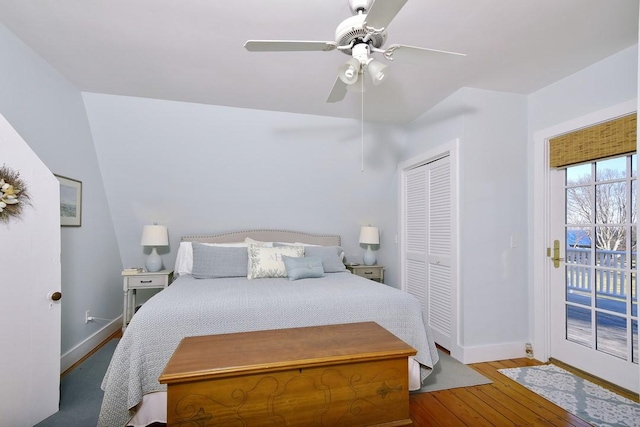 bedroom with hardwood / wood-style flooring, ceiling fan, access to outside, and a closet