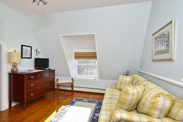 living area featuring wood-type flooring and a baseboard radiator