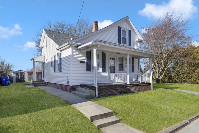 view of front of property featuring a front lawn and covered porch