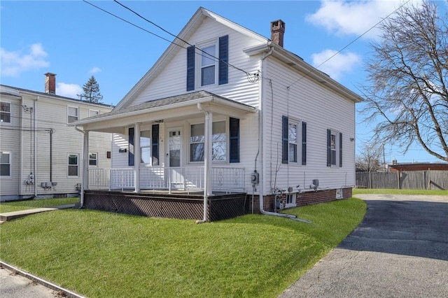 view of front of house featuring a front lawn and a porch