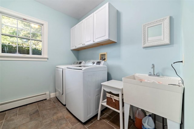 laundry area with washer and dryer, sink, cabinets, and a baseboard heating unit