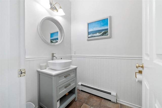 bathroom with vanity and baseboard heating