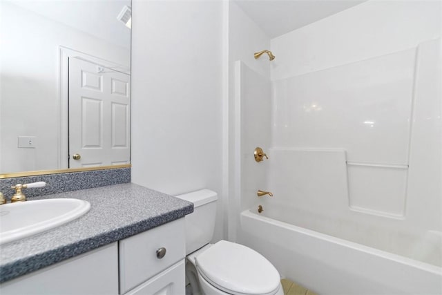 full bathroom featuring vanity, bathtub / shower combination, and toilet