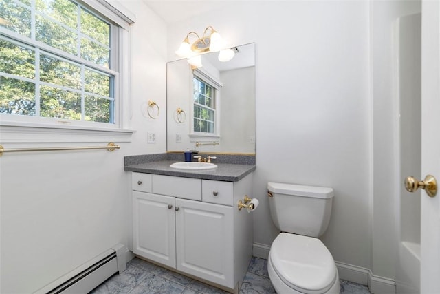 bathroom with vanity, a baseboard radiator, and toilet