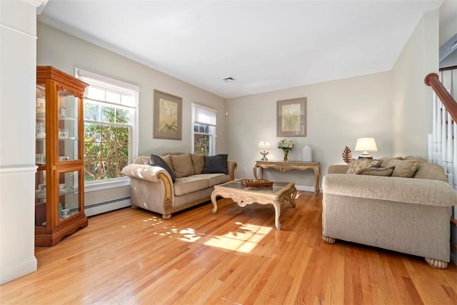 living room featuring light hardwood / wood-style flooring and baseboard heating