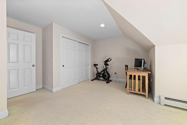 interior space with carpet floors, a baseboard radiator, and lofted ceiling