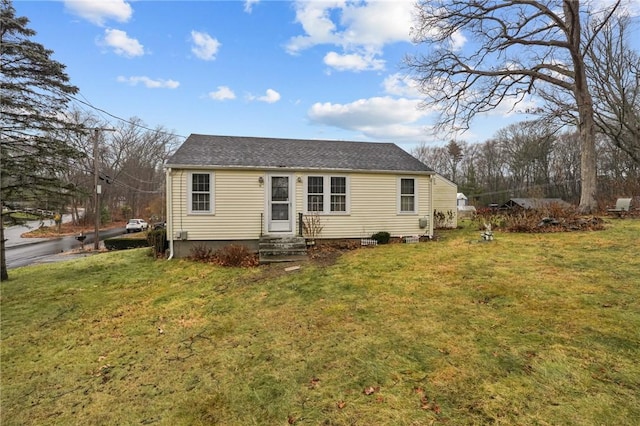 view of front of home with a front lawn