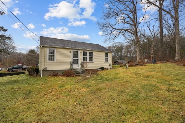 view of front of property with a front lawn