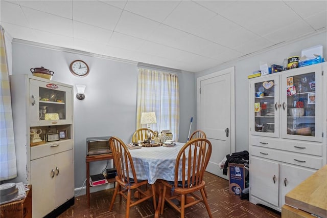 dining room with dark parquet flooring