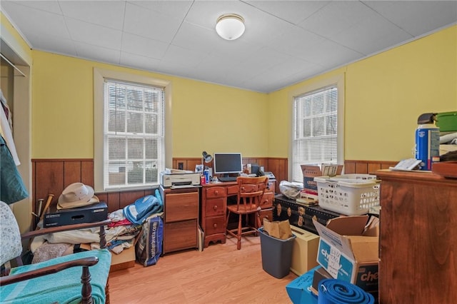 home office with wooden walls and light wood-type flooring