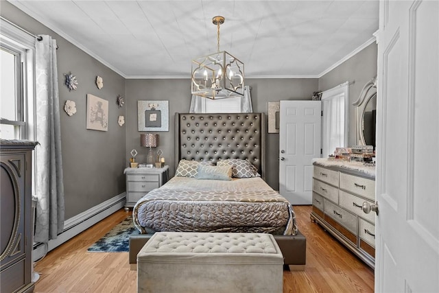 bedroom with baseboard heating, ornamental molding, a chandelier, and light wood-type flooring