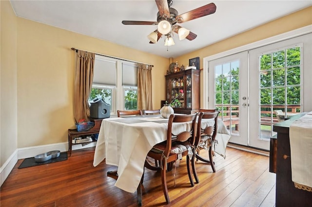 dining area with hardwood / wood-style floors, ceiling fan, and french doors