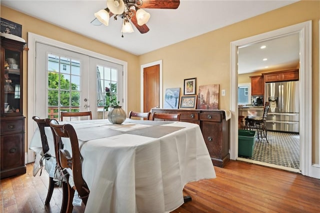 dining area featuring ceiling fan, french doors, and light hardwood / wood-style flooring