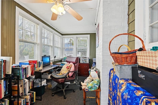 carpeted home office with crown molding and wooden walls