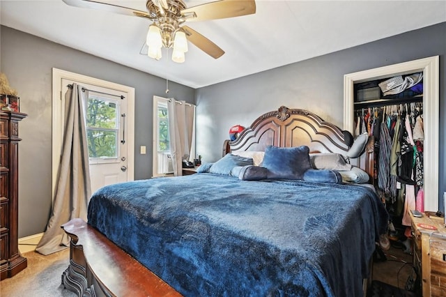 bedroom featuring ceiling fan, a closet, and carpet